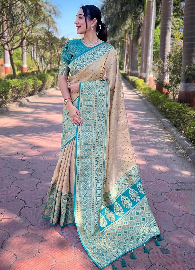 Beige woven self design embellished tissue kanjivaram saree with blouse