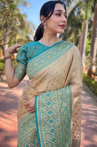 Beige woven self design embellished tissue kanjivaram saree with blouse