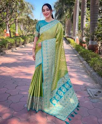 Green woven self design embellished tissue kanjivaram saree with blouse 1