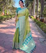 Green woven self design embellished tissue kanjivaram saree with blouse