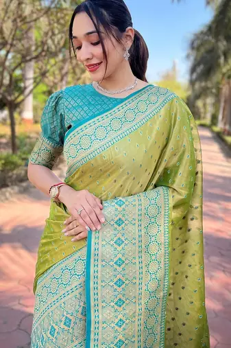 Green woven self design embellished tissue kanjivaram saree with blouse