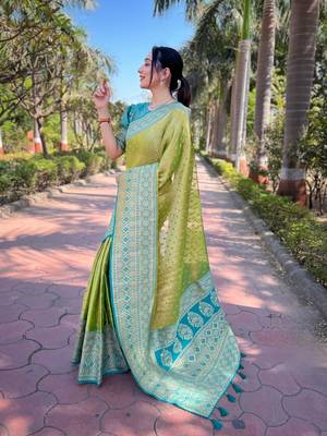 Green woven self design embellished tissue kanjivaram saree with blouse 3