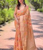 Peach woven embellished organza kanjivaram saree with blouse