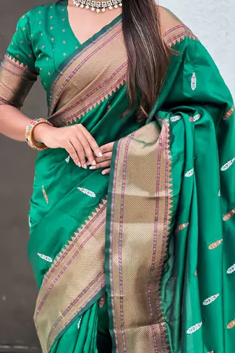 Green woven self design pure silk paithani saree with blouse