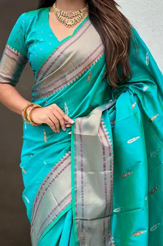 Teal green woven self design pure silk paithani saree with blouse