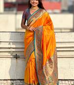 Orange woven self design pure silk paithani saree with blouse