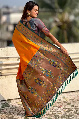 Orange woven self design pure silk paithani saree with blouse