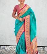 Sea green woven self design pure silk paithani saree with blouse