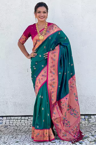 Teal green woven self design pure silk paithani saree with blouse