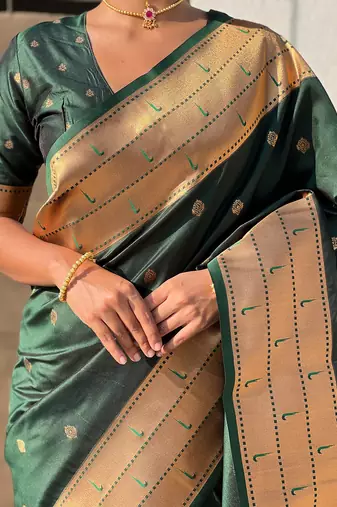 Dark green woven self design pure silk paithani saree with blouse