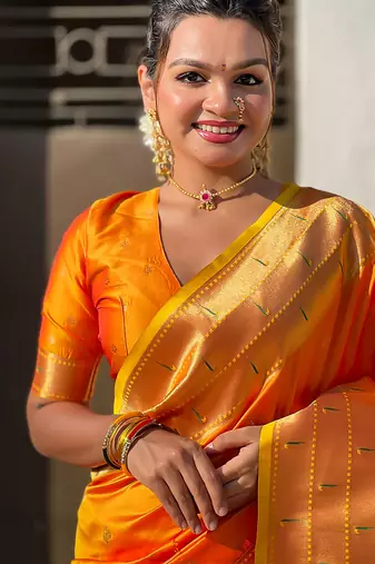 Orange woven self design pure silk paithani saree with blouse