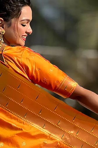 Orange woven self design pure silk paithani saree with blouse