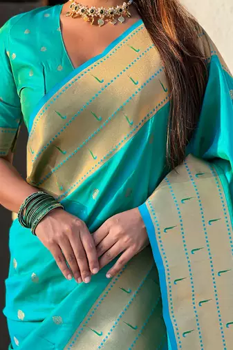 Sea green woven self design pure silk paithani saree with blouse