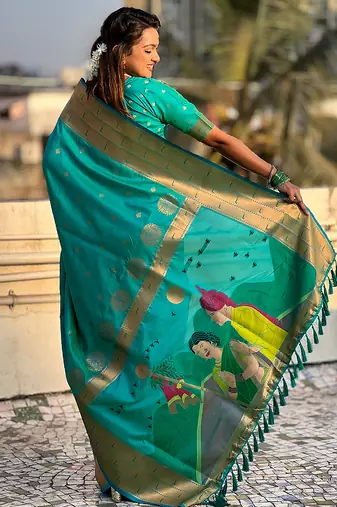Sea green woven self design pure silk paithani saree with blouse