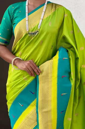 Parrot green woven self design pure silk paithani saree with blouse
