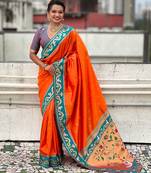 Orange woven self design pure silk paithani saree with blouse