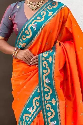 Orange woven self design pure silk paithani saree with blouse