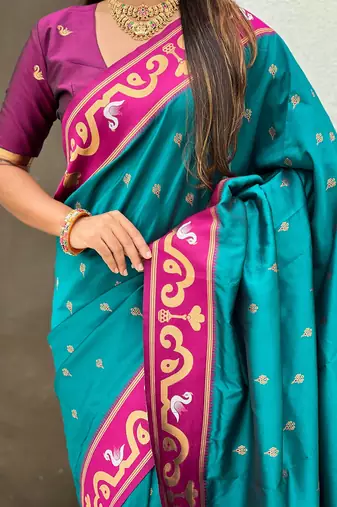 Teal blue magenta woven self design pure silk paithani saree with blouse