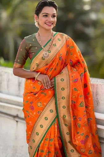 Orange woven self design pure silk paithani saree with blouse