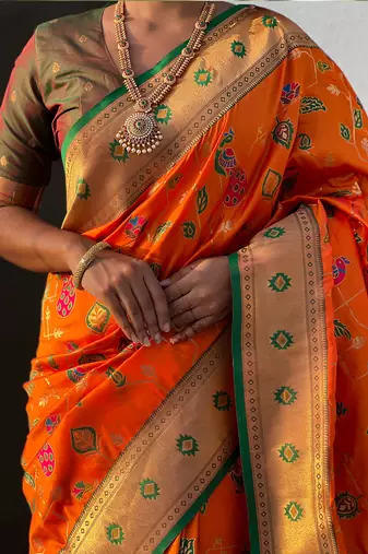 Orange woven self design pure silk paithani saree with blouse