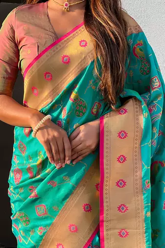 Sea green woven self design pure silk paithani saree with blouse