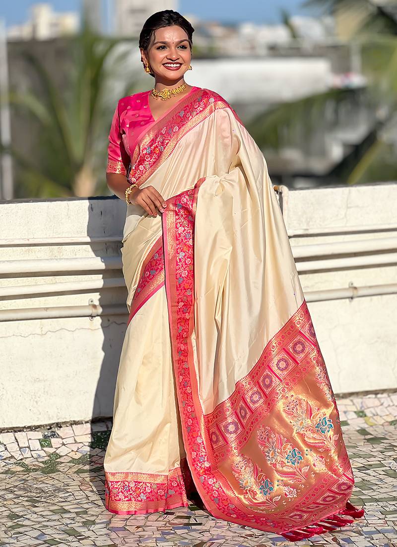 Cream woven self design pure silk paithani saree with blouse