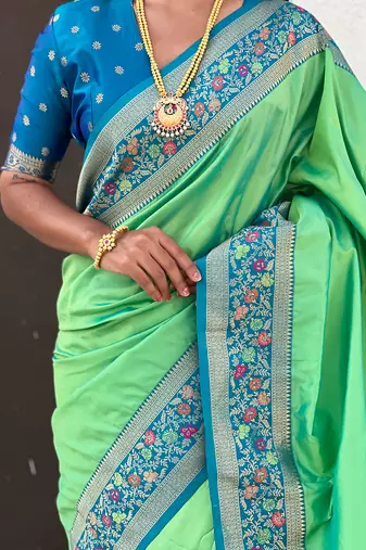 Pista green woven self design pure silk paithani saree with blouse