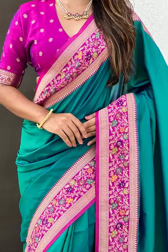 Teal green woven self design pure silk paithani saree with blouse