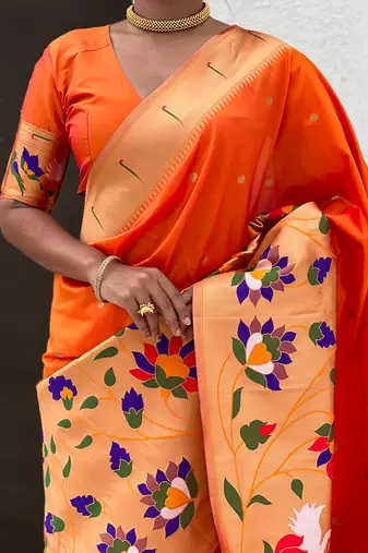 Orange woven self design pure silk paithani saree with blouse