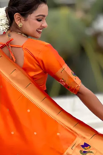 Orange woven self design pure silk paithani saree with blouse