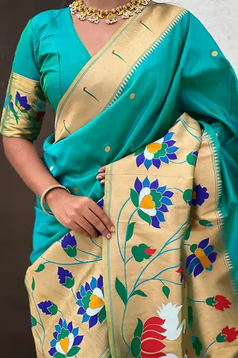 Sea green woven self design pure silk paithani saree with blouse