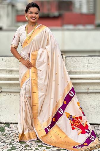 Cream woven self design pure silk paithani saree with blouse