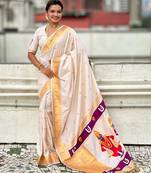 Cream woven self design pure silk paithani saree with blouse