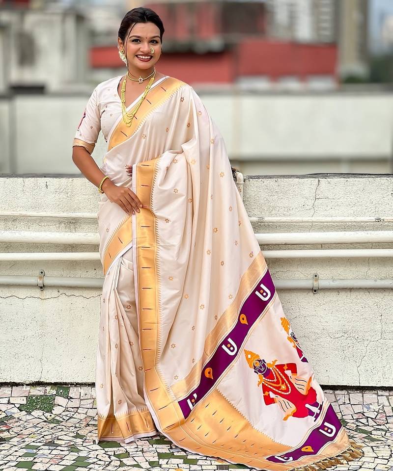 Cream woven self design pure silk paithani saree with blouse