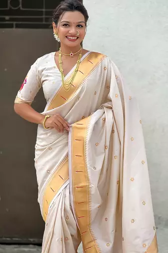 Cream woven self design pure silk paithani saree with blouse