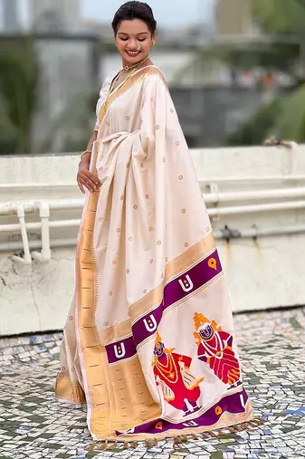 Cream woven self design pure silk paithani saree with blouse