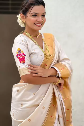 Cream woven self design pure silk paithani saree with blouse