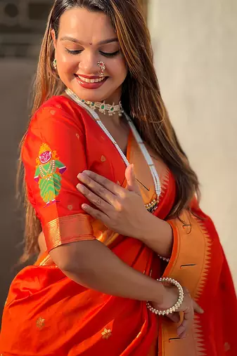 Orange woven self design pure silk paithani saree with blouse
