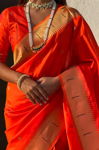 Orange woven self design pure silk paithani saree with blouse