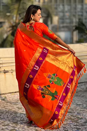 Orange woven self design pure silk paithani saree with blouse
