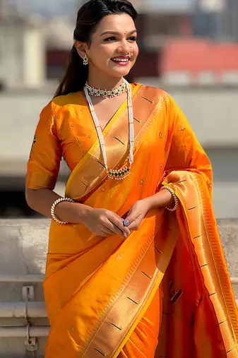 Yellow woven self design pure silk paithani saree with blouse