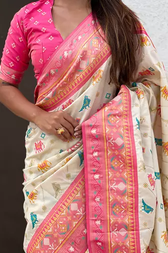 Cream woven self design silk blend patola saree with blouse