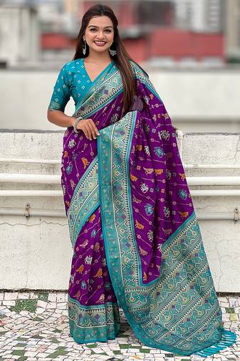 Purple woven self design silk blend patola saree with blouse
