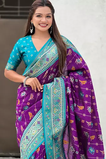 Purple woven self design silk blend patola saree with blouse