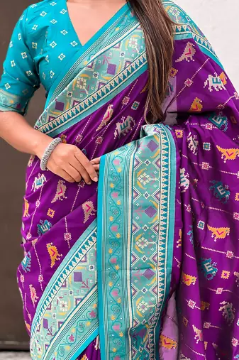 Purple woven self design silk blend patola saree with blouse