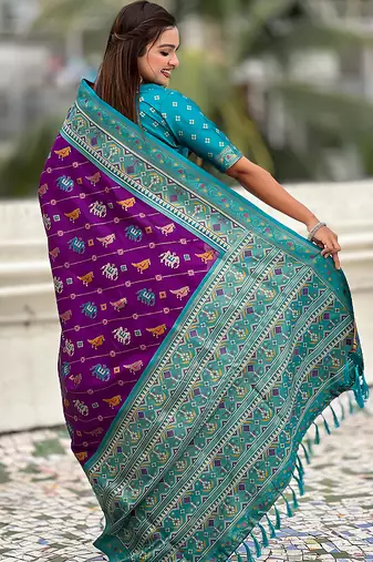 Purple woven self design silk blend patola saree with blouse