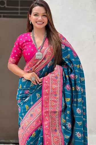 Teal blue woven self design silk blend patola saree with blouse