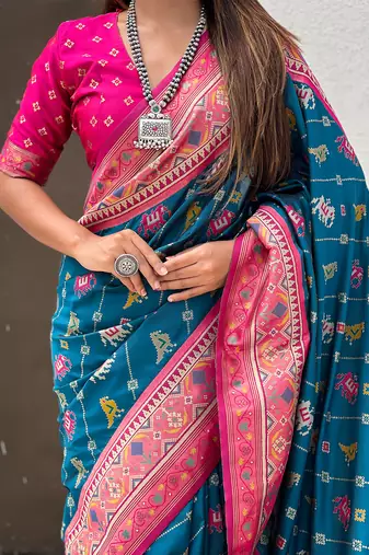 Teal blue woven self design silk blend patola saree with blouse