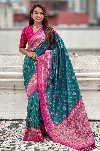 Teal green woven self design silk blend patola saree with blouse