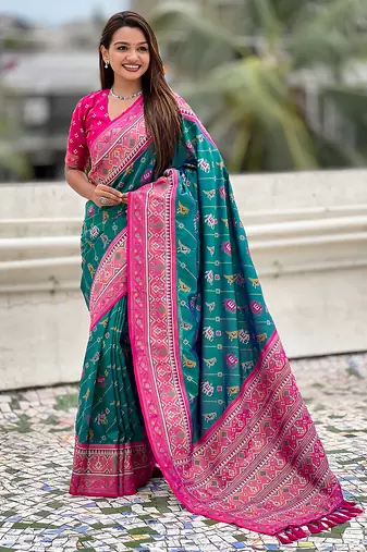 Teal green woven self design silk blend patola saree with blouse